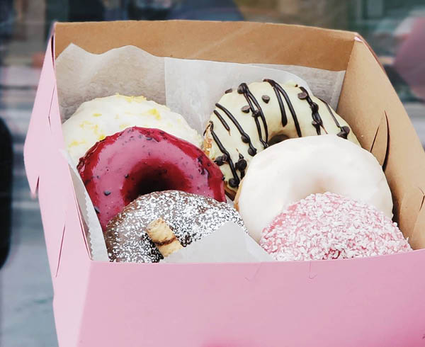Pink box full of Strange Matter Donuts, photo credit Strange Matter Coffee