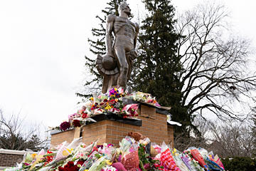 Spartan Statue memorial flowers