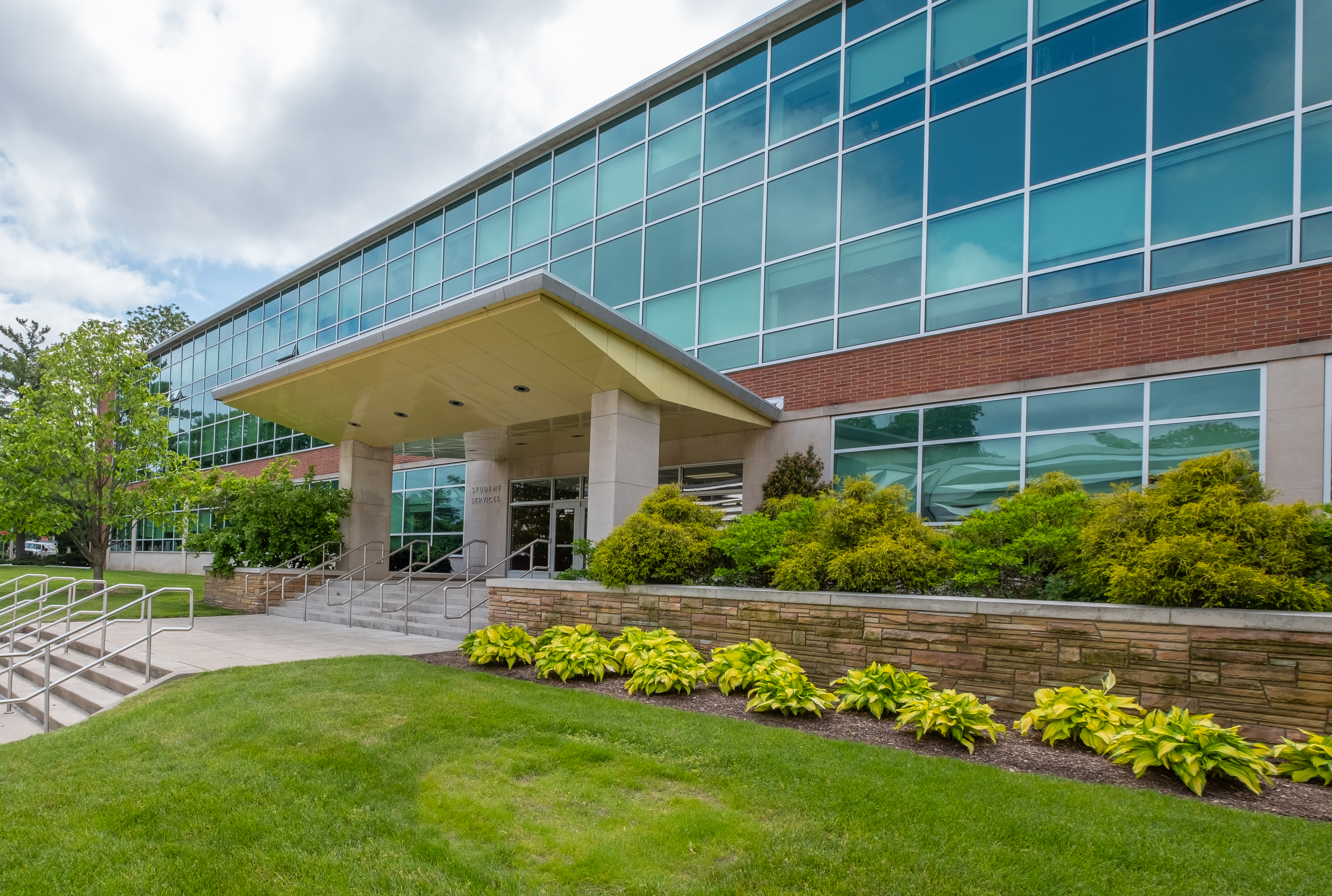 a photo of the front entrance to MSU's Student Services Building on a sunny day