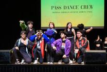 Pilipino American Student Society Dance Crew performers pose on stage. Photograph by Dane Robison.