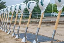 Shovels in ground in anticipation of groundbreaking ceremony