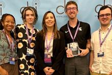 Student leaders from Impact 89FM pose with CBI President Annabella Poland when receiving the first-place award for Best Student Media Web Site. Pictured left to right: Music Director Sydney Sims, Photo Editor Catherine Grumish, CBI President Annabella Poland, Digital Media Director Jake Rhodes, Audio Production Director Drew Silski 