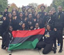 BSA students pose with flag