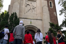 Group of Ohio State students standing in front of Beaumount Tower.